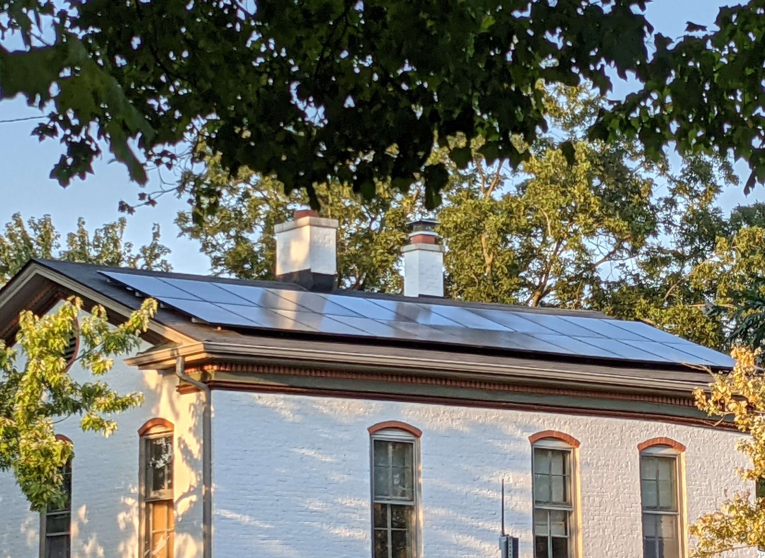 Photo of Anne Mills' solar array on her 1869 home in Greensburg, IN